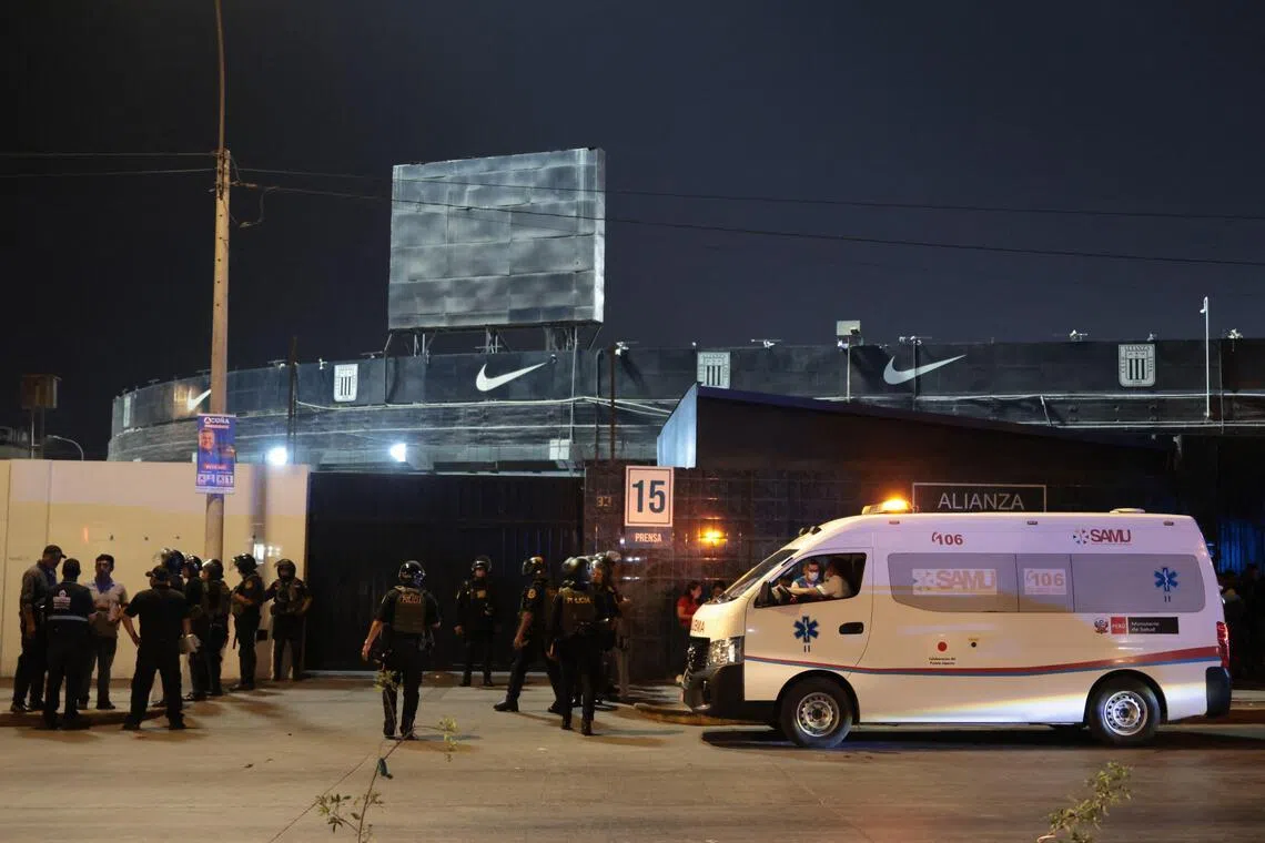 An ambulance is seen at the entrance of the Alejandro Villanueva Stadium after an accident in the stands, where Alianza Lima's fans were cheering and waving flags for their team on the eve of the match against Universitario in the Peruvian capital on April 3, 2026.