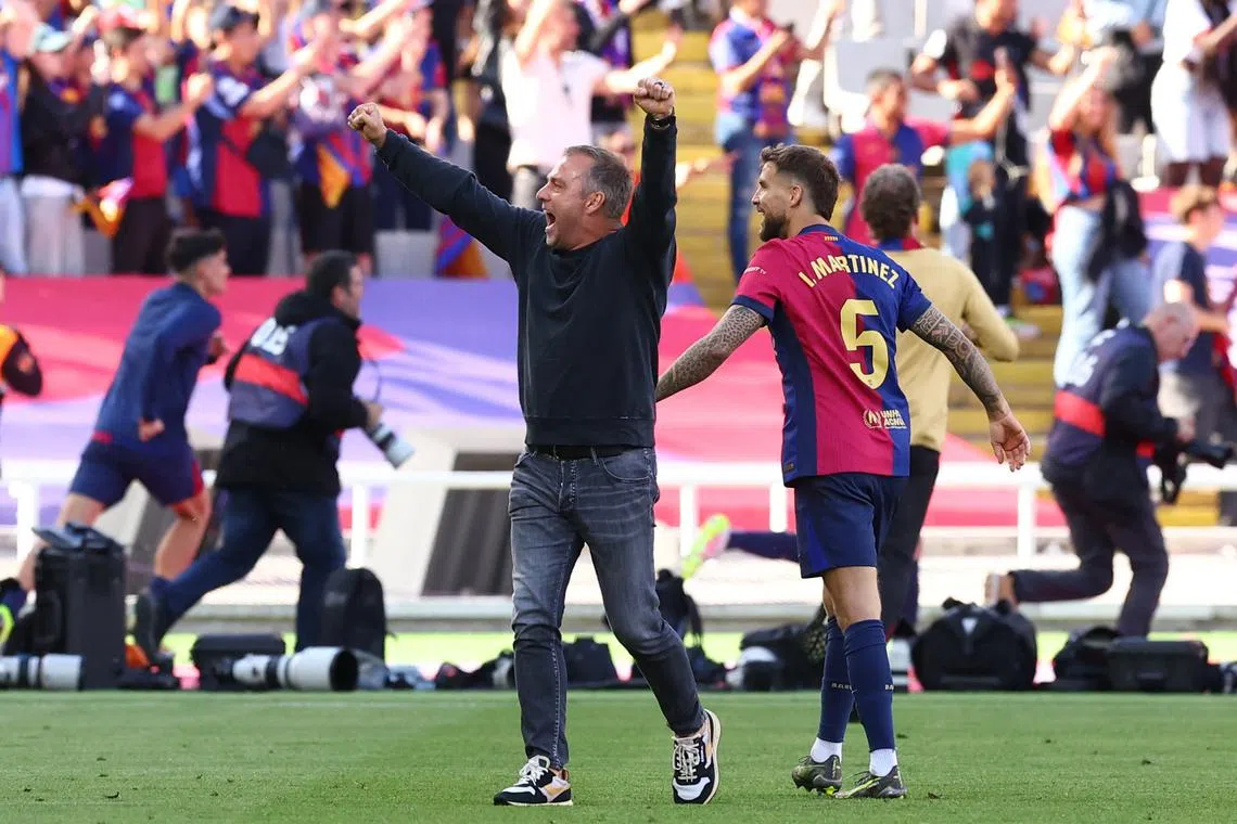 Soccer Football - LaLiga - FC Barcelona v Real Madrid - Estadi Olimpic Lluis Companys, Barcelona, Spain - May 11, 2025 FC Barcelona coach Hansi Flick celebrates with Inigo Martinez after the match REUTERS/Albert Gea
