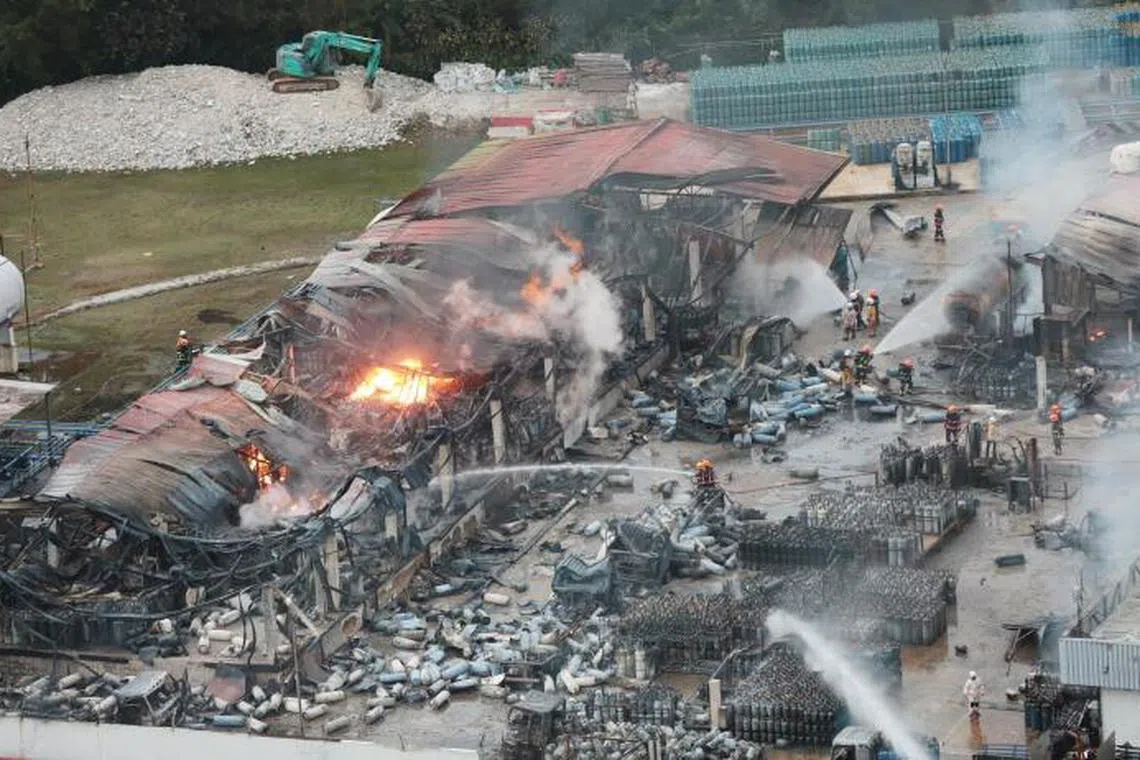 Firefighters tackling the blaze in Jalan Buroh on June 21, 2019. It was one of the cases highlighted by MOM.