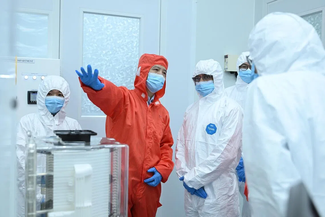 Dr Richard Yang, founder and CEO, Applied Angstrom Technology gives a tour of the cleanroom of the Atomic Precision Innovation Center on March 18.