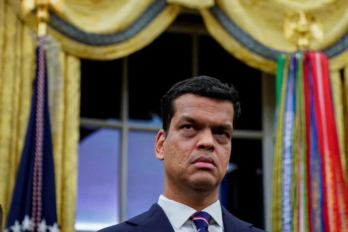 FILE PHOTO: Sriram Krishnan, Senior White House Policy Advisor on Artificial Intelligence, listens prior to U.S. President Donald Trump (not pictured) signing an executive order on AI in the Oval Office at the White House in Washington, D.C., U.S. December 11, 2025. REUTERS/Al Drago/File Photo