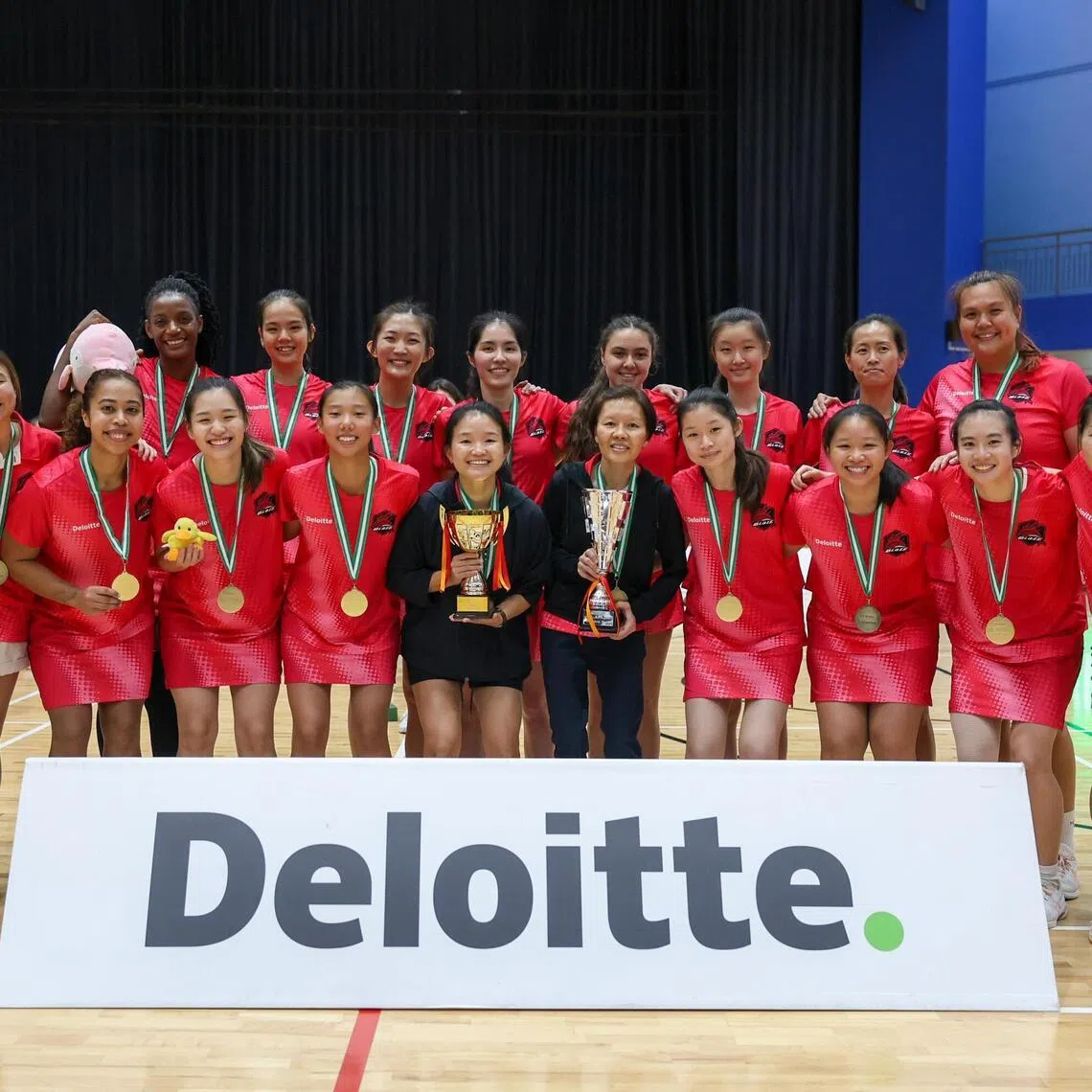 Blaze co-captain Laura Low (first row, second from right) marks her first full season back from injury by clinching the 2026 Netball Super League title.