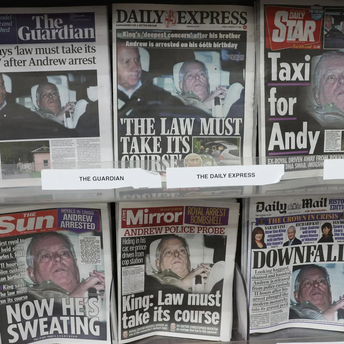 British newspapers, featuring coverage of the arrest of Andrew Mountbatten-Windsor, younger brother of Britain's King Charles, on suspicion of misconduct in public office, sit on display in a newsagent in London, Britain, February 20, 2026. REUTERS/Jack Taylor