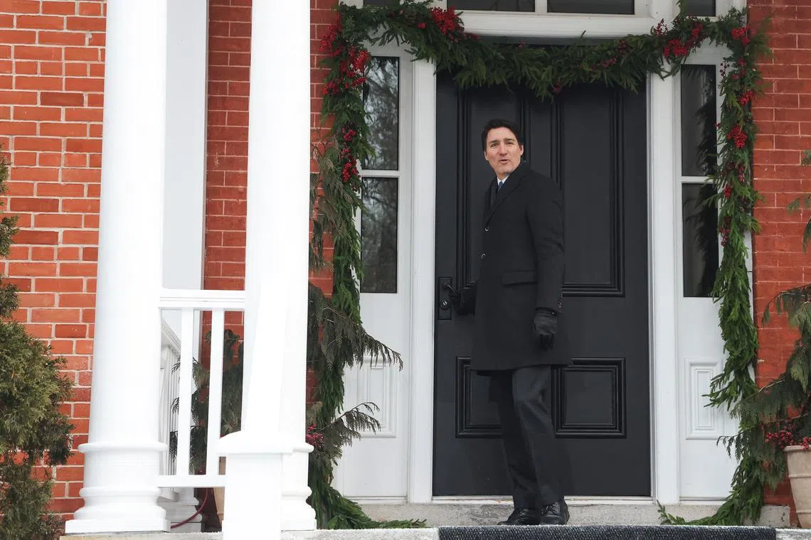 Canada's Prime Minister Justin Trudeau closes the door of his Rideau Cottage residence, ahead of speaking to reporters to announce he intends to step down as Liberal Party leader, but he will stay on in his post until a replacement has been chosen, in Ottawa, Ontario, Canada, January 6, 2025. REUTERS/Patrick Doyle