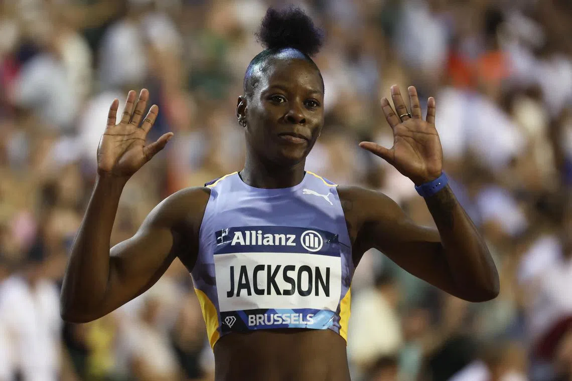 Jamaica's Shericka Jackson celebrates after winning the women's 200m final at the Brussels Diamond League.