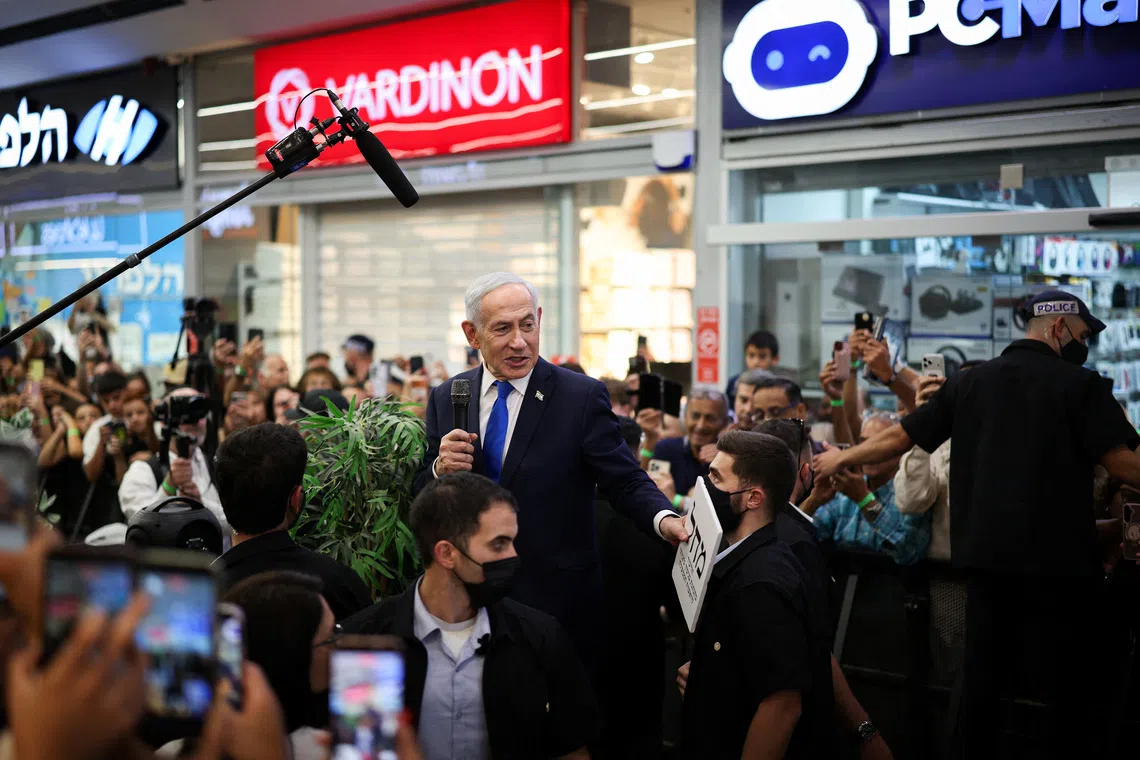 Israeli Prime Minister Benjamin Netanyahu meets members of the public, ahead of Israel’s national election, in Yokneam Illit, Israel.