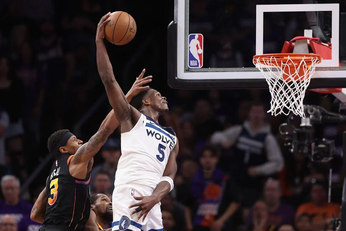Anthony Edwards of the Minnesota Timberwolves dunking the ball ahead of Bradley Beal of the Phoenix Suns during the second half of Minnesota's 122-116 Game 4 victory in the Western Conference first-round play-offs at Footprint Centre on April 28. The Timberwolves won the series 4-0.
