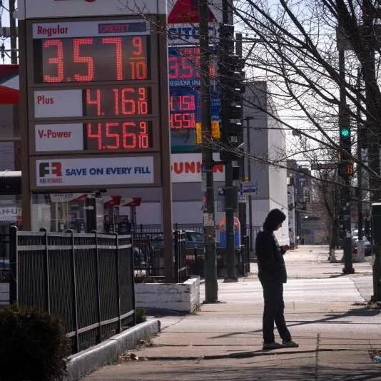 A sign displays prices for gasoline at a station on March 02, 2026 in Chicago, Illinois. 