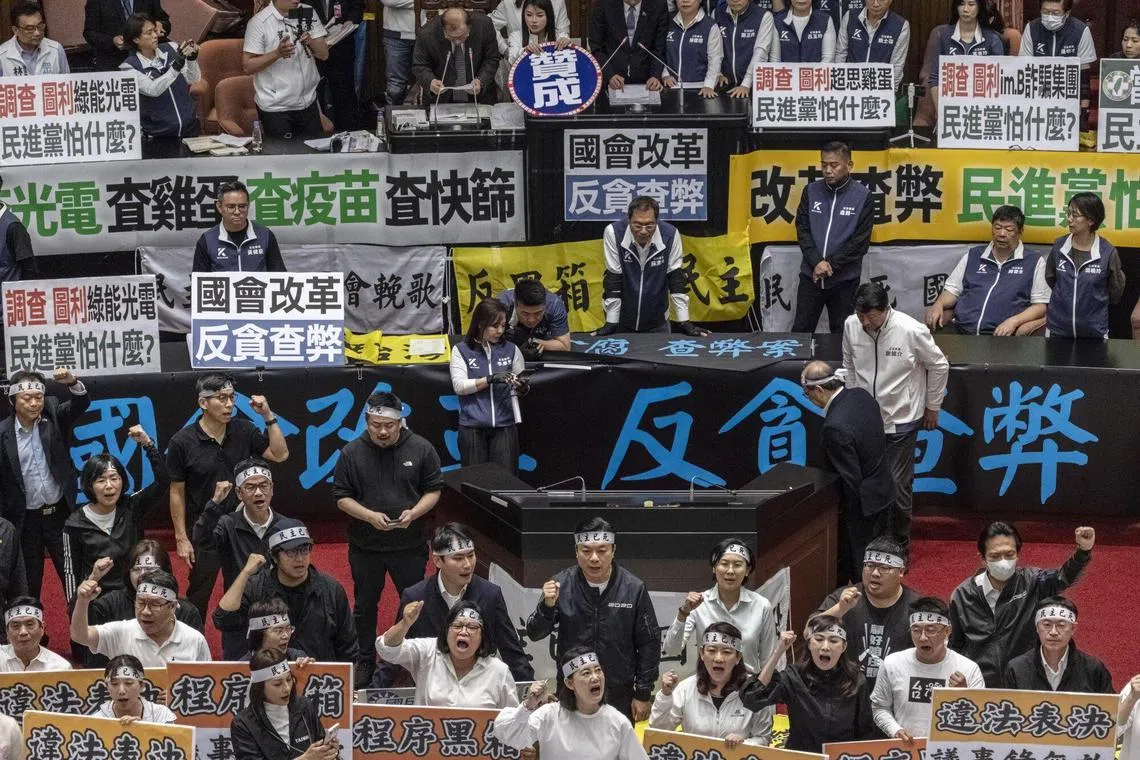 Democratic Progressive Party (DPP) lawmakers protest at the Legislative Yuan in Taipei on May 24, 2024.