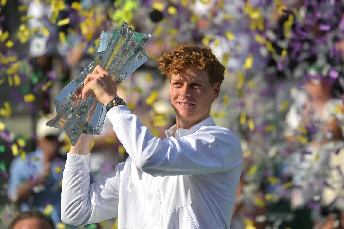 Mar 15, 2026; Indian Wells, CA, USA;  Jannik Sinner (ITA) celebrates with the championship trophy after he defeated Daniil Medvedev (RUS) in the menÕs final of the BNP Paribas Open at the Indian Wells Tennis Garden. Mandatory Credit: Jayne Kamin-Oncea-Imagn Images