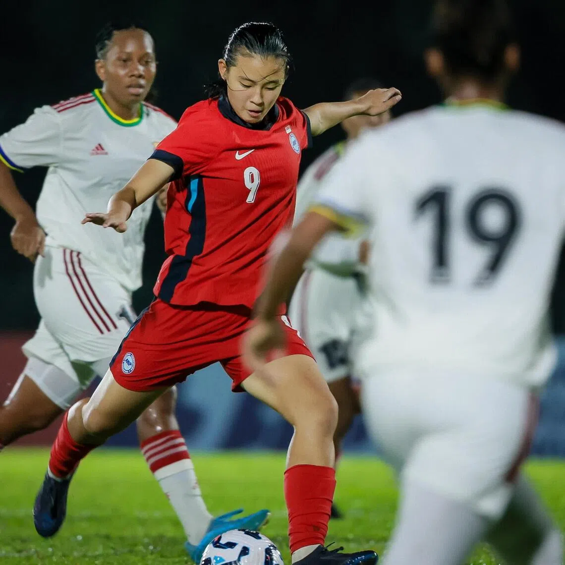 Singapore Danelle Tan (in red) scored twice in the 7-0 friendly win over Seychelles at the Bukit Gombak Stadium on Nov 28.