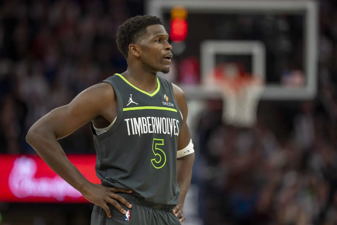FILE PHOTO: Dec 21, 2024; Minneapolis, Minnesota, USA; Minnesota Timberwolves guard Anthony Edwards (5) looks on against the Golden State Warriors in the second half at Target Center. Mandatory Credit: Jesse Johnson-Imagn Images/File photo