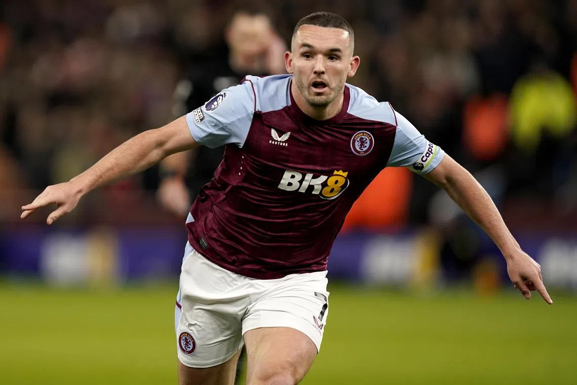 Aston Villa's John McGinn celebrates after scoring against Arsenal.