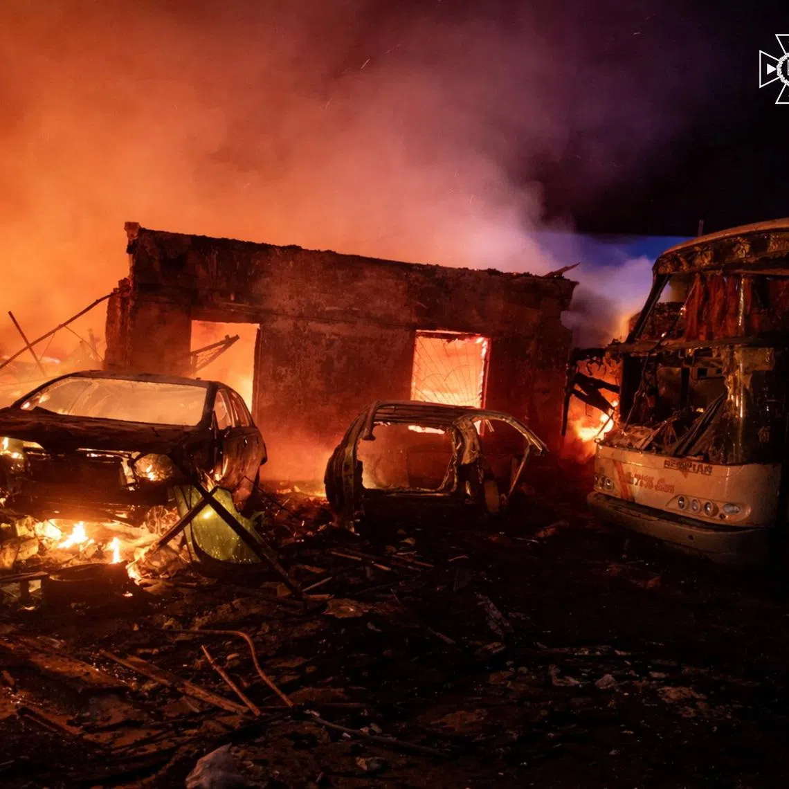 Smoke rises over burning cars and buildings at the site of a vehicles repair workshop hit during overnight Russian drone strikes, amid Russia's attack on Ukraine, in Odesa region, Ukraine April 14, 2026. Press service of the State Emergency Service of Ukraine in Odesa region/Handout via REUTERS