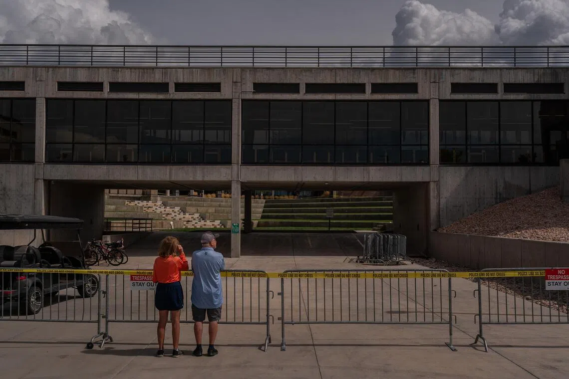 People visit the site where political activist Charlie Kirk was shot dead, on the Utah Valley University campus in Orem.