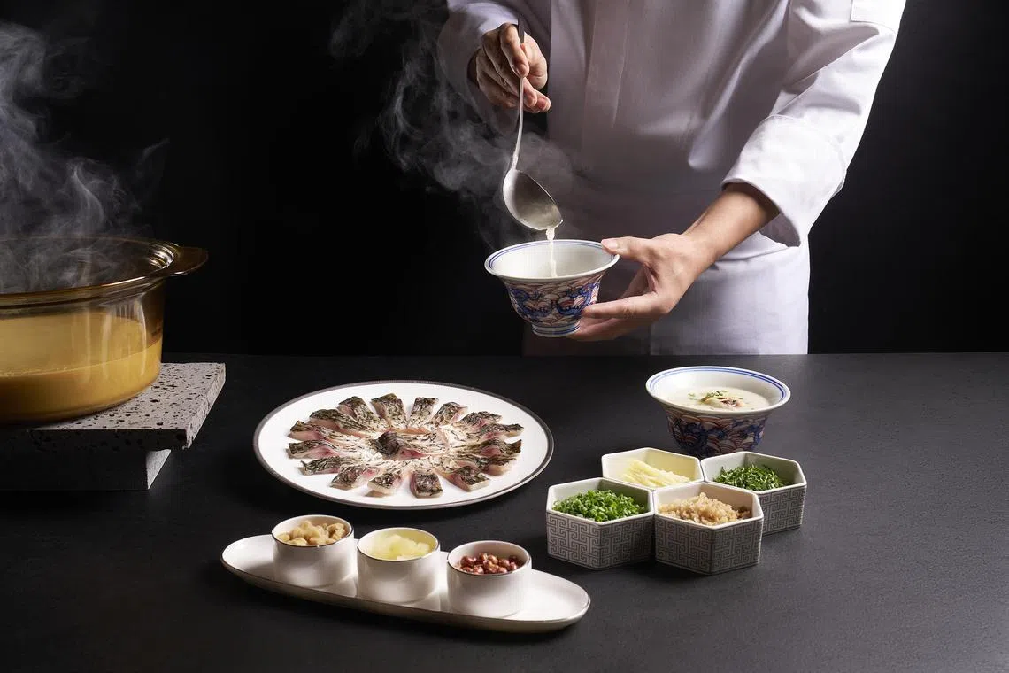Signature boneless crucian carp congee, where the fish is meticulously deboned and gently cooked in a comforting porridge.