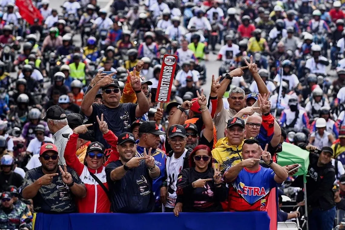 Venezuelan transport workers travel in a caravan in support of captured President Nicolas Maduro and his wife Cilia Flores, over a week after the U.S. launched a strike on the country, in Caracas, Venezuela January 13, 2026. REUTERS/Maxwell Briceno TPX IMAGES OF THE DAY