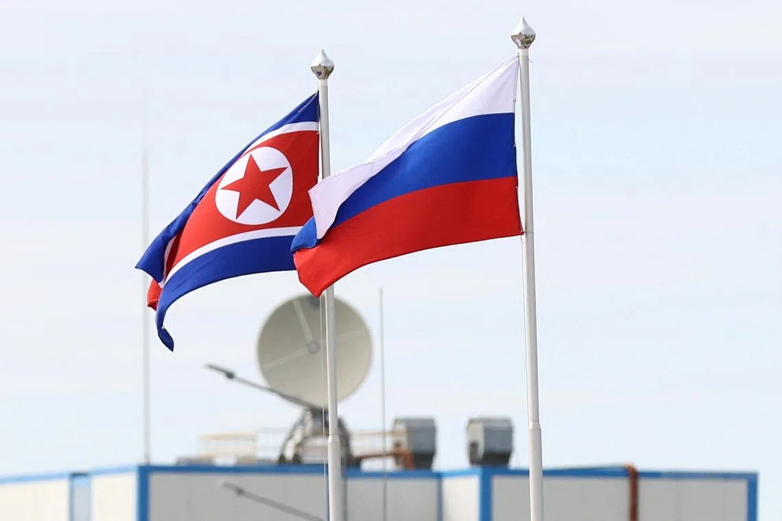 FILE PHOTO: Russian and North Korean flags fly at the Vostochny Сosmodrome in the far eastern Amur region, Russia, September 13, 2023. Sputnik/Artem Geodakyan/Pool via REUTERS/File Photo