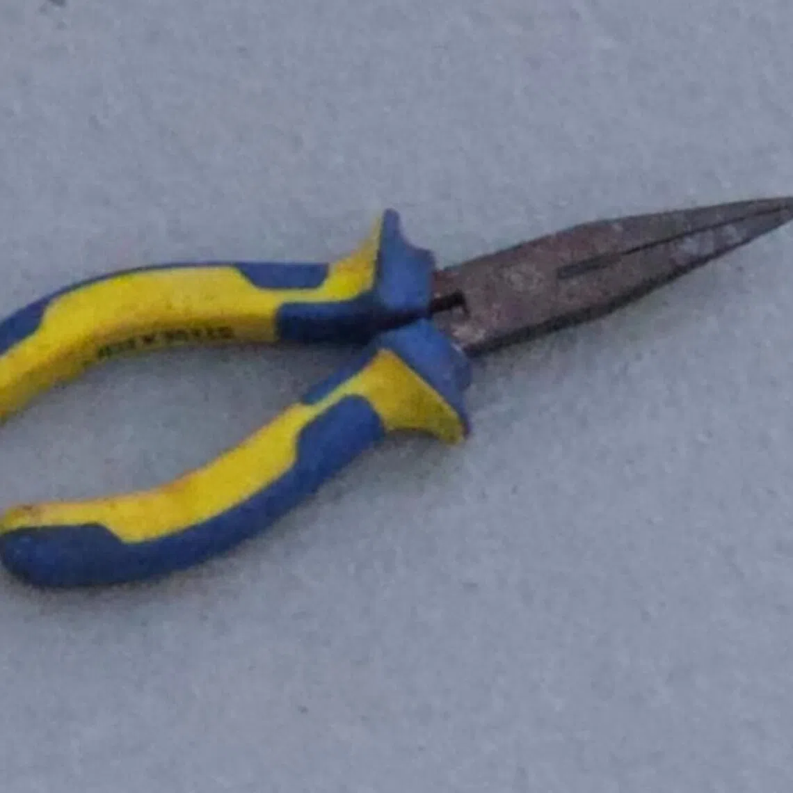 During the dispute, the man used a pair of pliers on the teenager, causing superficial injuries.