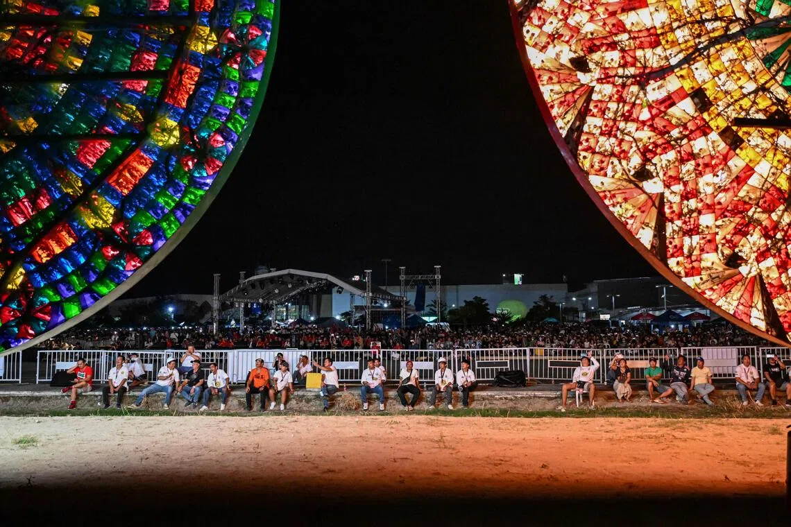 This photo taken on Dec 14 shows people watching during the Giant Lantern Festival in San Fernando, Pampanga. 