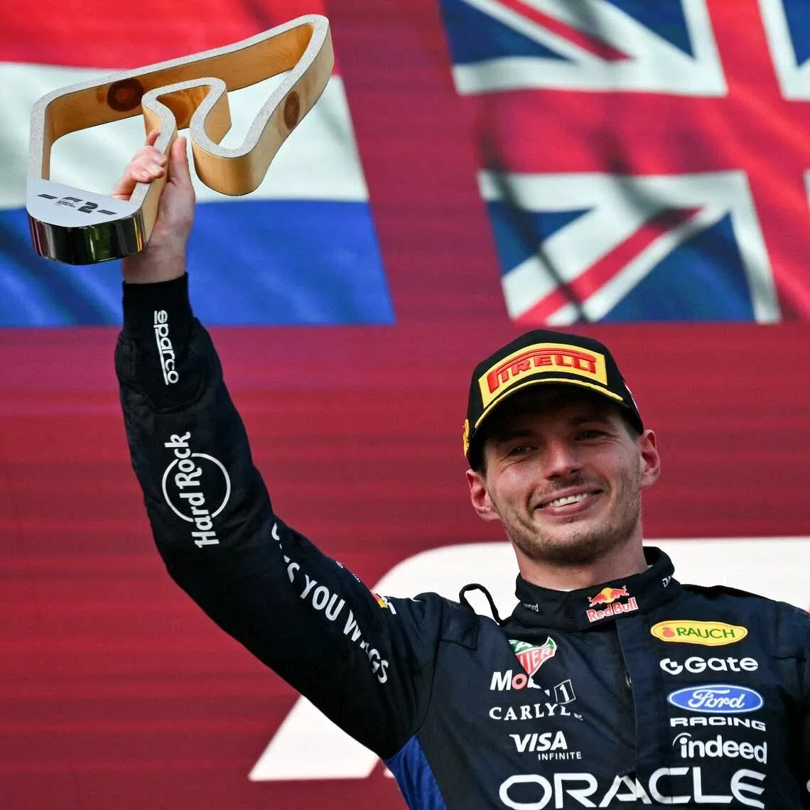 Red Bull Racing’s Max Verstappen is all smiles with his second-place trophy on the Austrian Grand Prix podium on June 28.