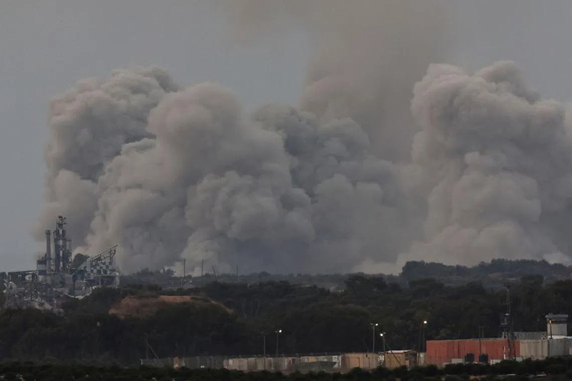 Smoke rises over Gaza, amid the ongoing conflict between Israel and the Palestinian Islamist group Hamas, as seen from southern Israel, December 7, 2023. REUTERS/Athit Perawongmetha