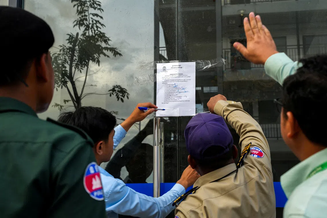 FILE PHOTO: Cambodian authorities places a order at a door of a building inside a compound, where South Korea's Vice Foreign Minister Kim Jina visited after meeting with Cambodian Prime Minister Hun Manet to discuss issues regarding job scams that resulted in the death of a South Korean university student, in Takeo province, Cambodia, October 16, 2025. REUTERS/Roun Ry/File Photo