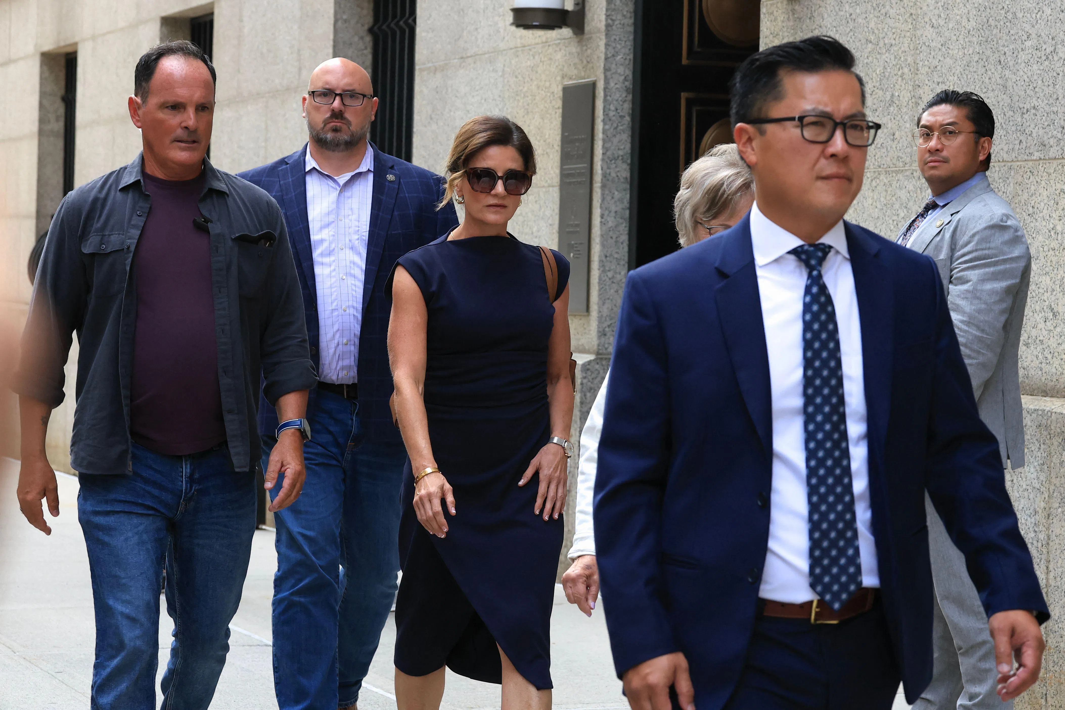 Paulette Thompson (centre), the widow of UnitedHealthcare CEO Brian Thompson, leaving court in New York on Aug 14, after Luigi Mangione pleaded guilty to killing her husband in 2024.