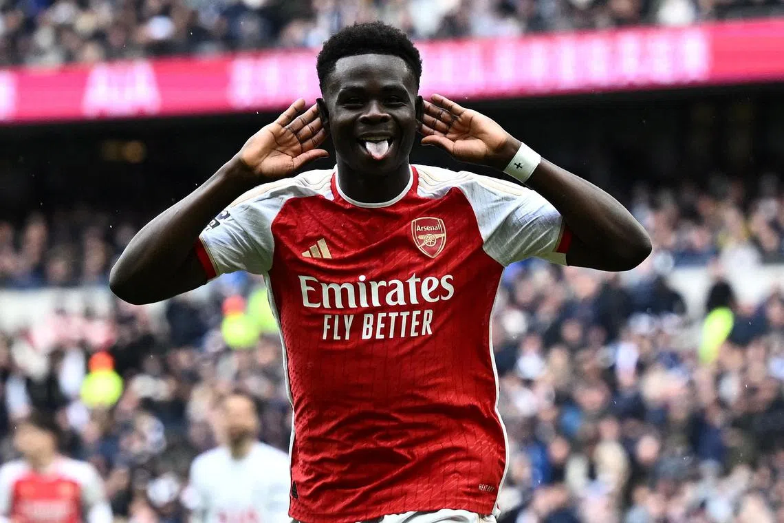 Arsenal's Bukayo Saka celebrates after scoring their second goal in the 3-2 English Premier League win away to local rivals Tottenham Hotspur on April 28.