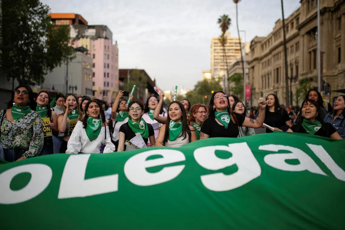 FILE PHOTO: Demonstrators carry a banner during a rally ahead International Safe Abortion Day, in Santiago, Chile September 27, 2024. REUTERS/Vanessa Rubilar/File Photo
