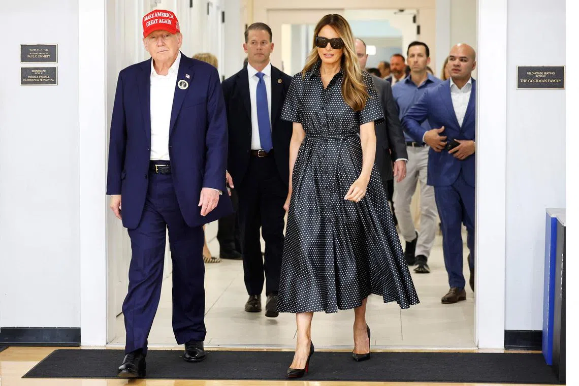 PALM BEACH, FLORIDA - NOVEMBER 05: Republican presidential nominee former President Donald Trump and his wife Melania Trump depart after casting their votes at a polling place in the Morton and Barbara Mandel Recreation Center on Election Day, on November 05, 2024 in Palm Beach, Florida. Trump will hold an Election Night event at the Palm Beach Convention Center.   Chip Somodevilla/Getty Images/AFP (Photo by CHIP SOMODEVILLA / GETTY IMAGES NORTH AMERICA / Getty Images via AFP)