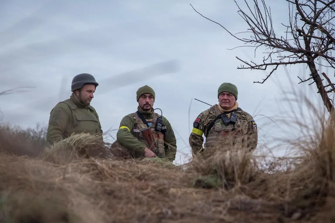 Ukrainian servicemen are seen at a front line position, in Ukraine's Kherson region, on Jan 4, 2022.