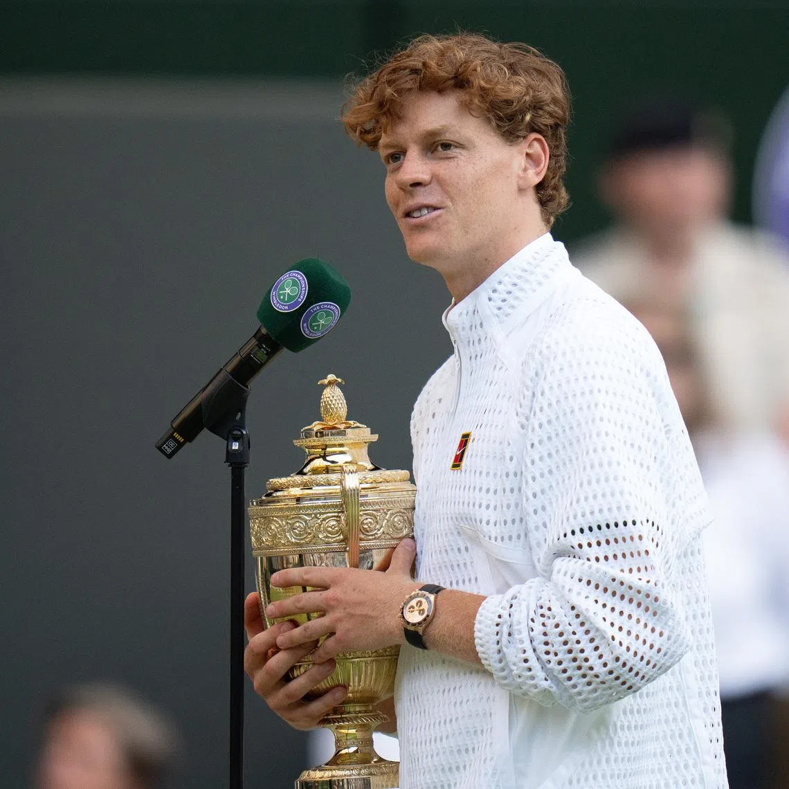 Jul 12, 2026; London, United Kingdom; Jannik Sinner of Italy at the on court interview after winning the men’s singles final against Alexander Zverev of Germany on day 14 at All England Lawn Tennis and Croquet Club.  Mandatory Credit: Susan Mullane-Imagn Images