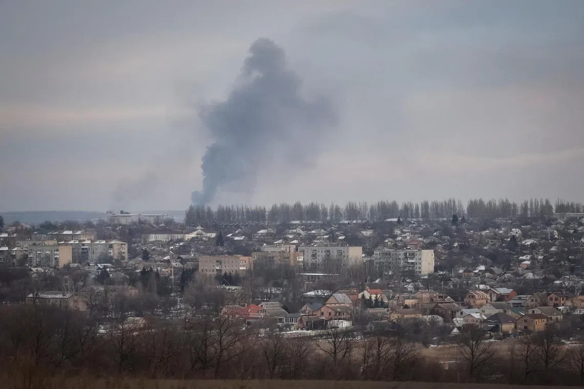 Smog is seen during a shelling, amid Russia's attack on Ukraine, in the front line city of Bakhmut in Donetsk region.