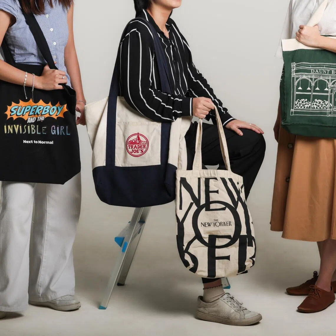 Photo of various popular tote bags, including those from Trader Joe?s, Daunt Books and The New Yorker, photographed at the ST photo studio on May 12, 2026.