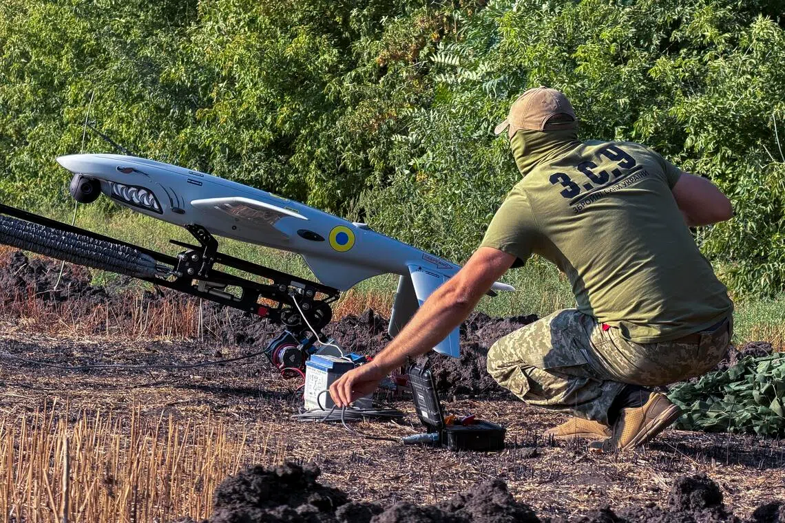 A Ukrainian serviceman preparing to launch a Hornet strike drone towards Russian positions in Ukraine’s Zaporizhzhia region on Aug 29.