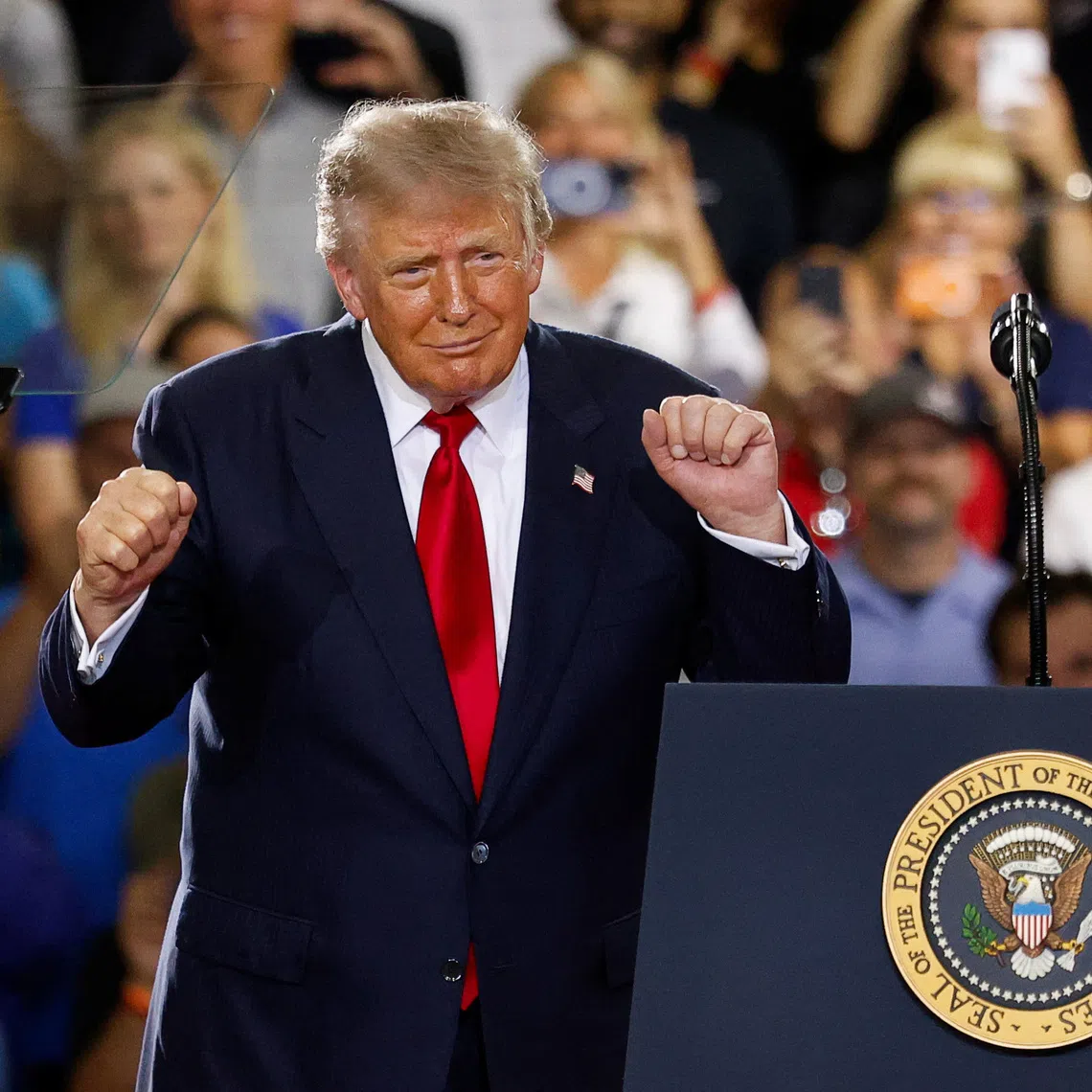 US President Donald Trump dances as he delivers remarks on the economy at the General Motors Proving Ground in Milford, Michigan, USA, on July 27.