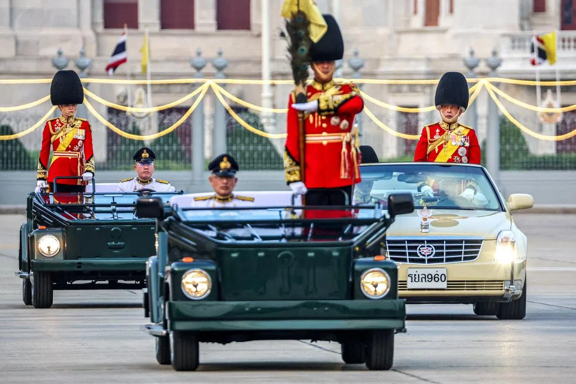 FILE PHOTO: Thailand's King Maha Vajiralongkorn and Queen Suthida review the guard of honour during a trooping of the colours ceremony to mark the 72nd birthday of Thailand's King Maha Vajiralongkorn in Bangkok, Thailand, December 3, 2024. REUTERS/Athit Perawongmetha/File Photo