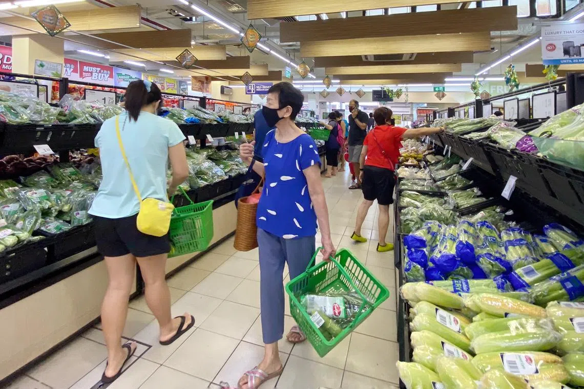 Customers shopping in the NTUC FairPrice at Taman Jurong Shopping Centre, 30 May 2020. This supermarket has been added to the list of public places visited by Covid-19 patients while they were still infectious.