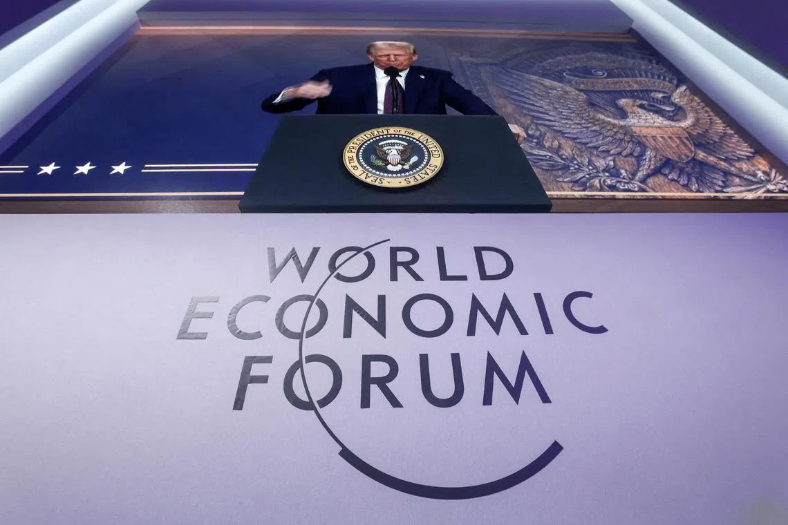 FILE PHOTO: U.S. President Donald Trump makes a special address remotely during the 55th annual World Economic Forum (WEF) meeting in Davos, Switzerland, January 23, 2025. REUTERS/Yves Herman/File Photo
