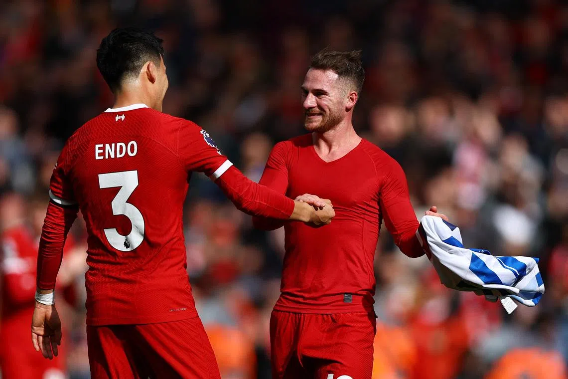 Liverpool's Wataru Endo and Alexis Mac Allister, seen here celebrating after Liverpool's 2-1 English Premier League win over Brighton & Hove Albion on March 31, have slotted in seamlessly after their summer arrivals.