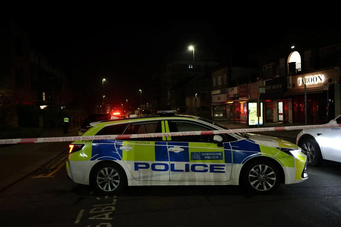 A police cordon line and police car near the scene after four ambulances belonging to Hatzola, a Jewish community organisation, were set on fire in an incident that the police say is being treated as an antisemitic hate crime, in northwest London, Britain, March 23, 2026. REUTERS/Isabel Infantes
