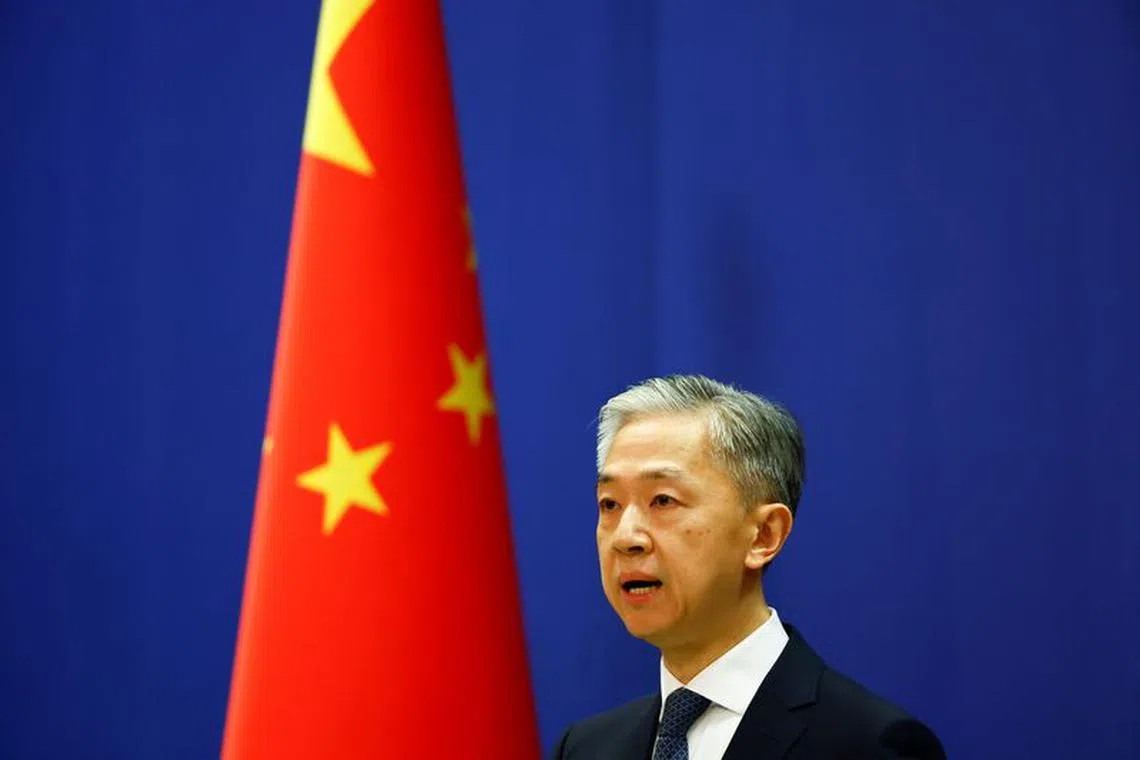 FILE PHOTO-Chinese Foreign Ministry spokesperson Wang Wenbin speaks during a news conference in Beijing, China March 3, 2022. REUTERS/Carlos Garcia Rawlins/File Photo