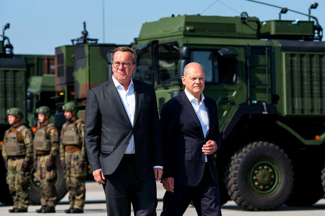 German Defence Minister Boris Pistorius (left) and German Chancellor Olaf Scholz visiting a German military base in November 2024.
