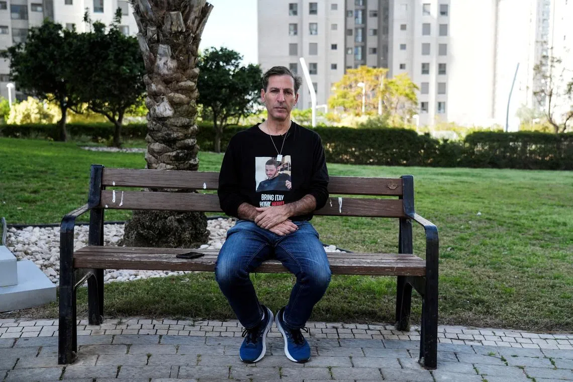 Ruby Chen, father of deceased U.S.-Israeli hostage Itay Chen, whose body is held by the Palestinian Islamist group Hamas in the Gaza Strip, sits on a park bench during an interview with Reuters in Netanya, Israel, March 13, 2024. REUTERS/Janis Laizans