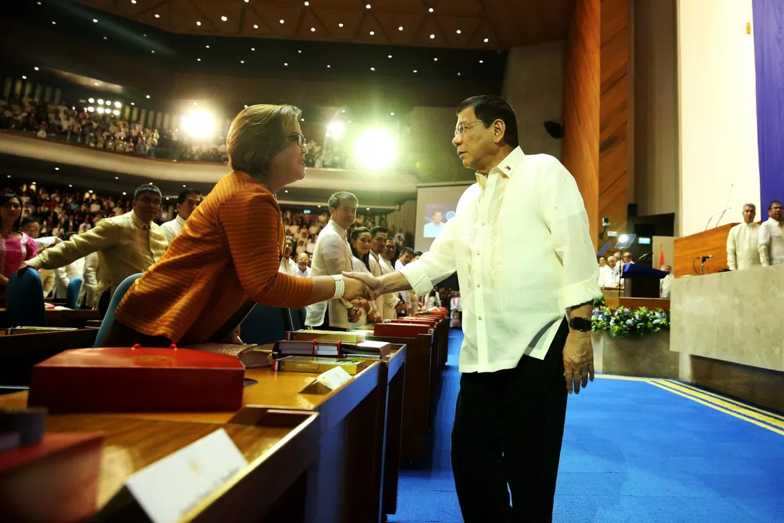 Then Philippine President Rodrigo Duterte and his top critic, Senator Leila de Lima, share a more cordial time in this July 25, 2016 file photo. 