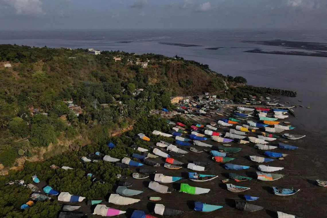 FILE PHOTO: An aerial view of fishing boats covered with tarpaulin sheets parked on the shore, before the start of the monsoon season, on the outskirts of Mumbai, India, June 8, 2023. REUTERS/Francis Mascarenhas/File Photo