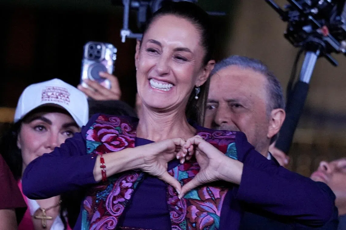 Presidential candidate of the ruling Morena party Claudia Sheinbaum, gestures to her supporters after winning the presidential election, at Zocalo Square in Mexico City, Mexico June 3, 2024. REUTERS/Alexandre Meneghini