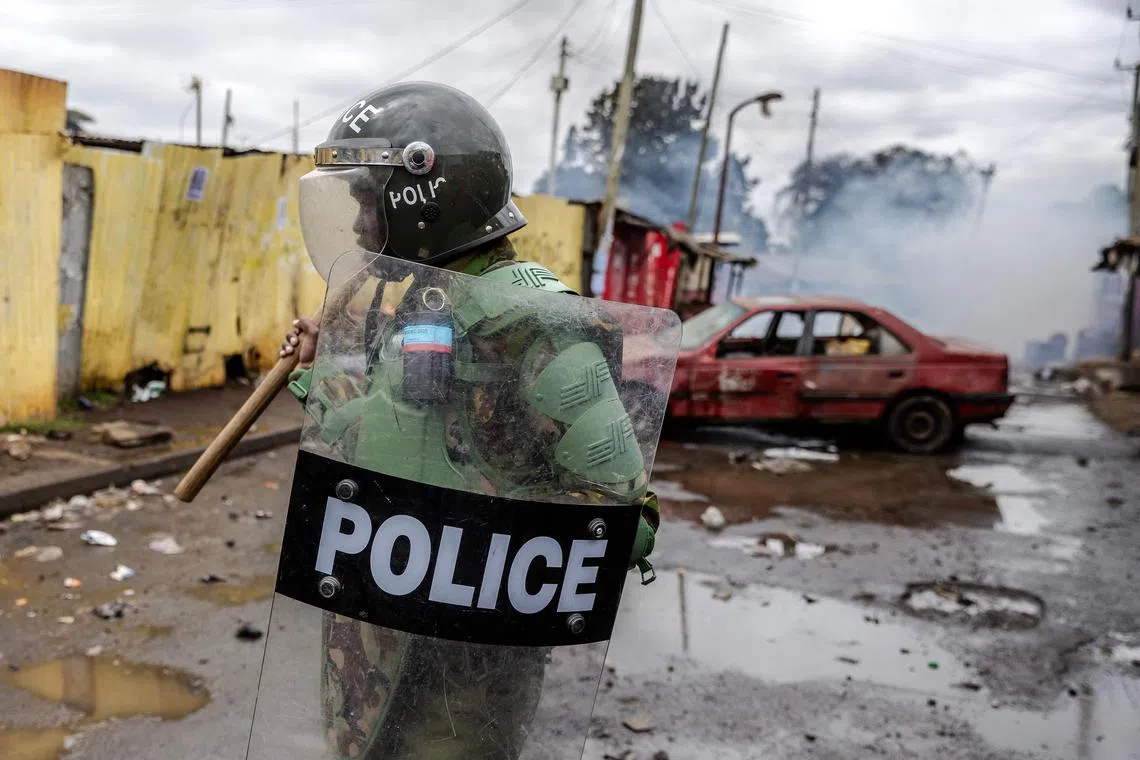 A Kenya Police Officer patrols during anti-government protests in Nairobi on July 19, 2023.