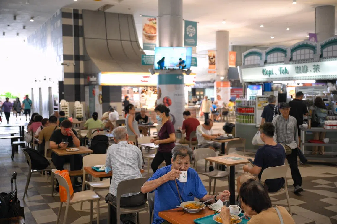 Patrons at the hawker centre of Kampung Admiralty, Singapore’s pioneering “retirement kampung”.